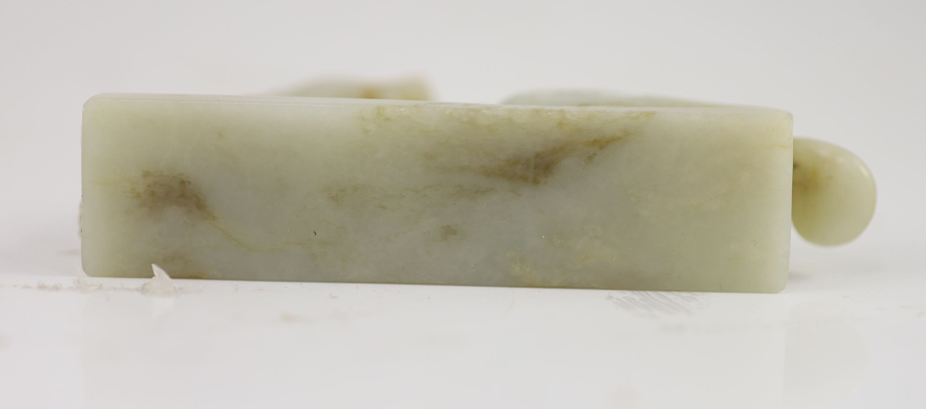 A Chinese Ming archaistic pale celadon and russet jade figure of a pixiu, 16th/17th century, 11.5cm long
